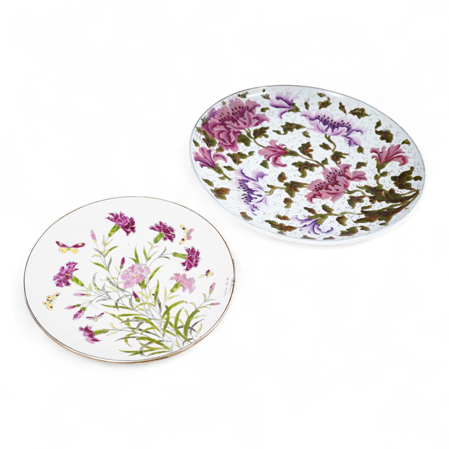 A Zsolnay-type floral charger, 39cm diameter and similar smaller Schutz Cilli plate